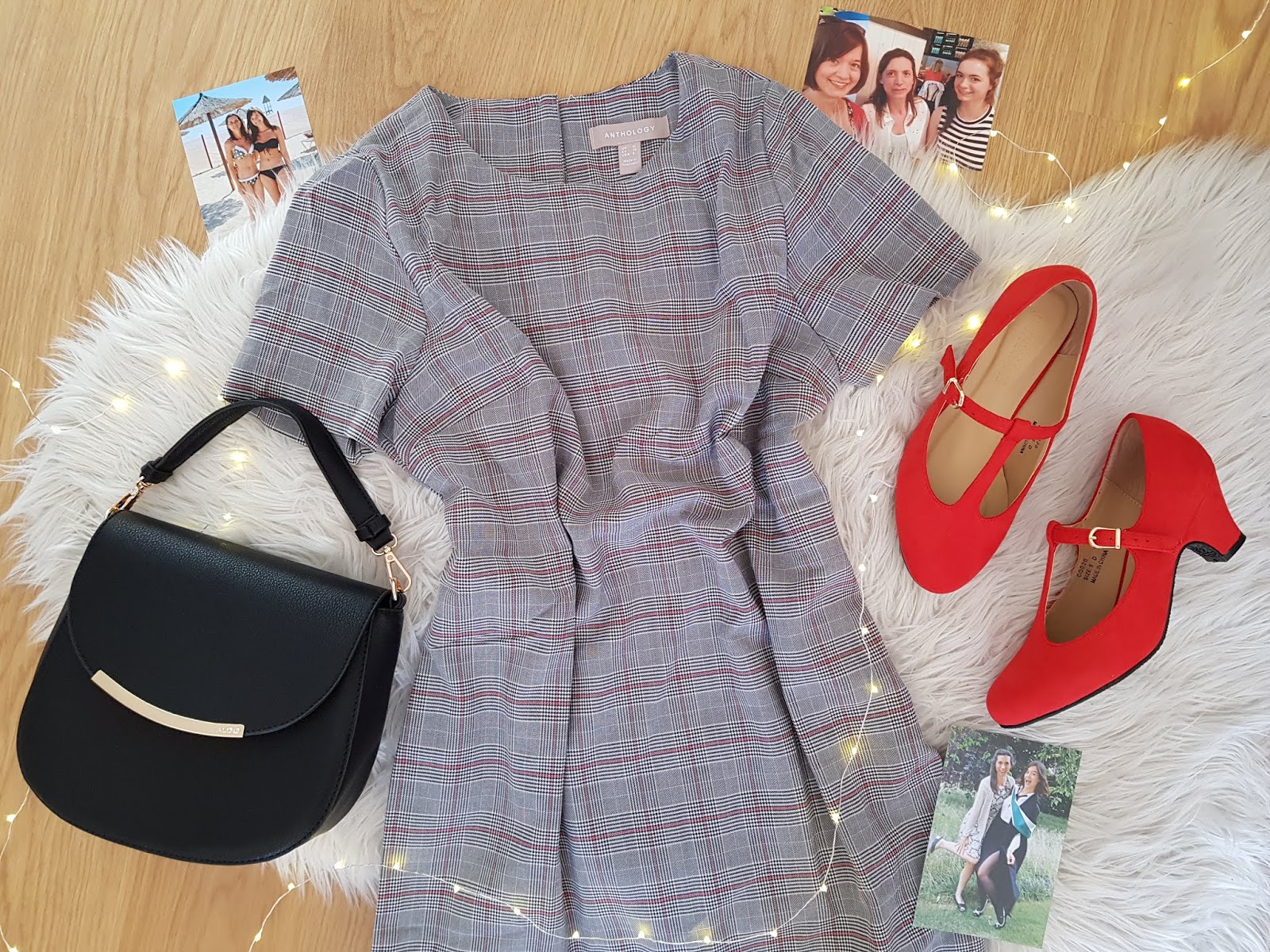 flatlay showing a dress, black leather handbag and red shoes, with photos of Abbey's Mum and fairy lights surrounding