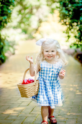 Wizard of Oz inspired family and children's photo shoot. Dorothy in ruby slippers on yellow brick road. Photo by Elles Photography