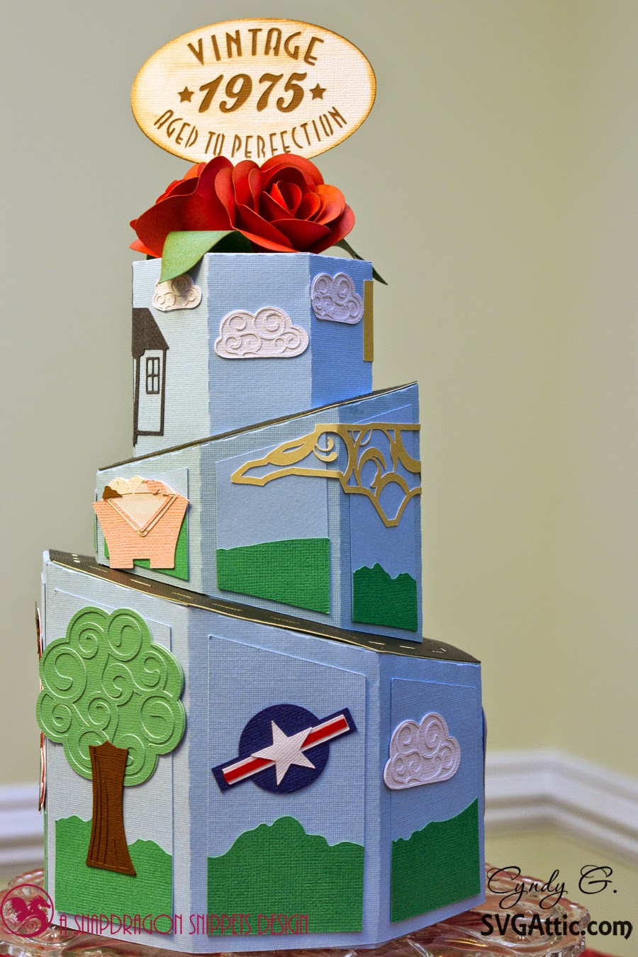 3d paper cake with life milestones i.e. born, wedding, children, etc.