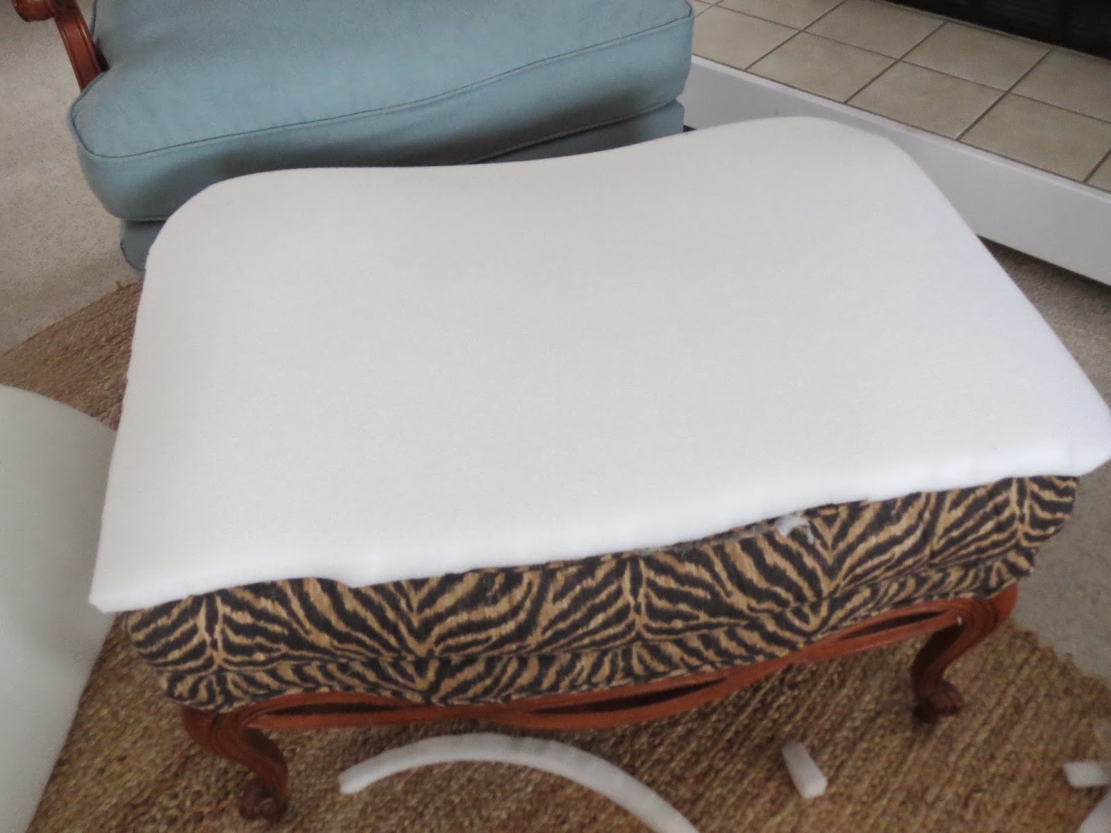 Gates of Crystal Reupholstering a Bergere Chair and Ottoman