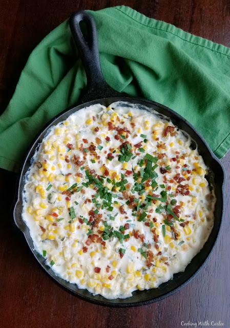 This creamy dip is loaded with corn, bacon and flavor. There is just a bit of heat that adds to the great taste. It is absolutely perfect with tortilla chips. Make it for a BBQ, potluck or party. It is a hit with our crowds every time we serve it! cast iron pan filled with kickin' corn dip