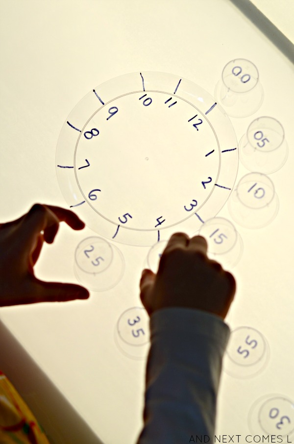 Learning about minutes and skip counting on the light table with this simple clock activity from And Next Comes L