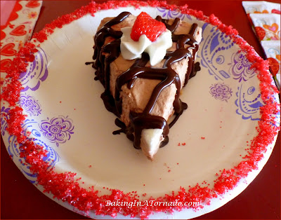 Strawberry Hot Fudge Pie, A fluffy refrigerator pie made with fresh strawberries and hot fudge sauce. Grab a plate and two forks, perfect for sharing with your valentine. | Recipe developed by www.BakingInATornado.com | #recipe #chocolate #pie #ValentinesDay