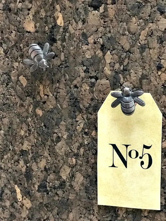 Cork board with bee thumb tacks