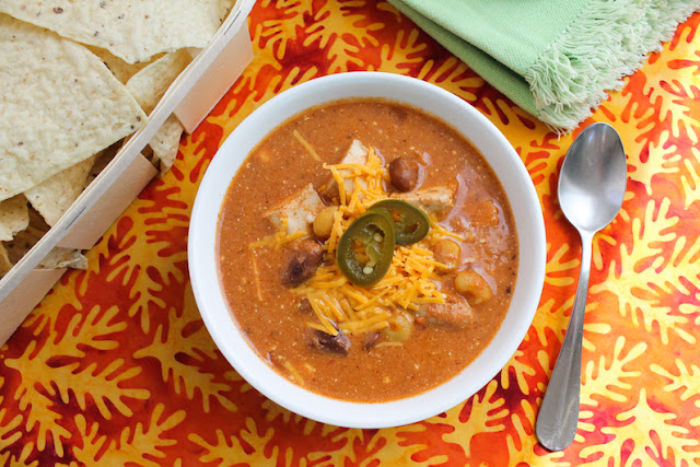 Food Lust People Love: This slow cooker cheesy chicken enchilada soup has all the wonderful flavors of your favorite enchilada dish in a warming bowl.