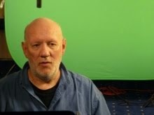 Brian Vike sitting in front of a green screen for the Discovery Channel TV UFO documentary.