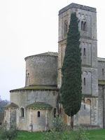 Montalcino's Sant'Antimo abbbey: bell tower and cypress tree