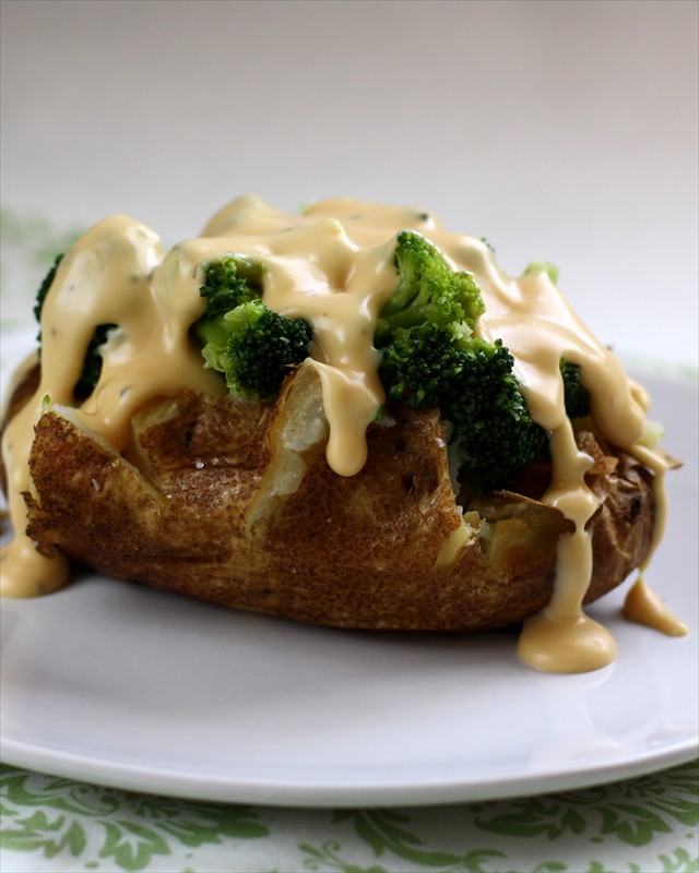 Baked+potatoes+with+cheese+sauce.butter+with+a+side+of+bread077