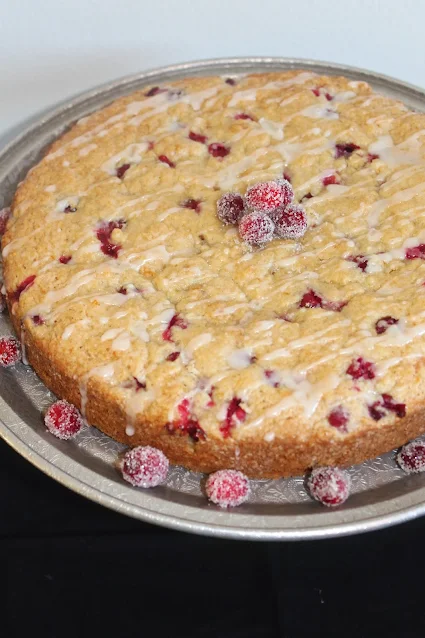 Finished orange scented cranberry cake with sugared cranberries.