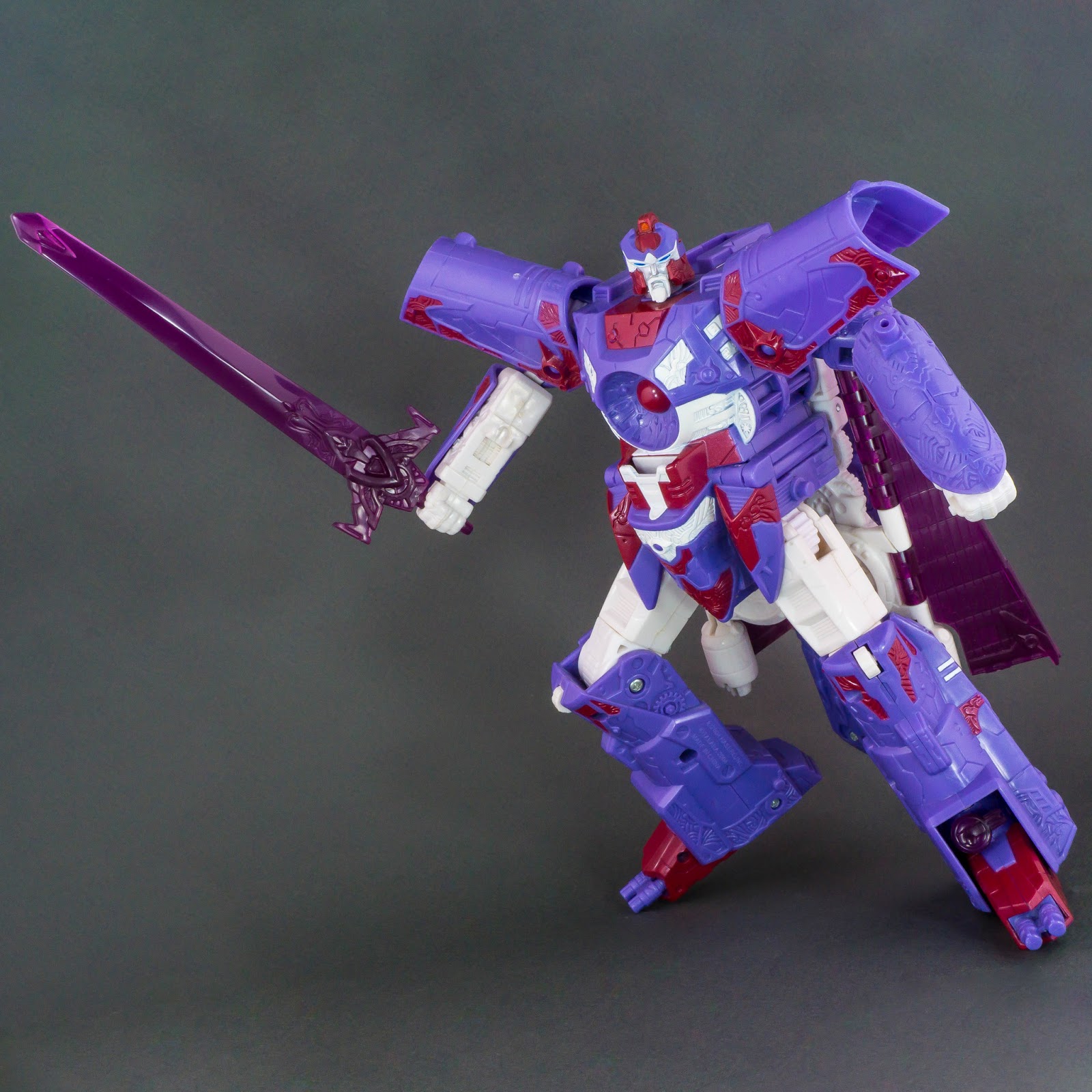 Transformers Botcon exclusive Alpha Trion robot mode posed with sword 1