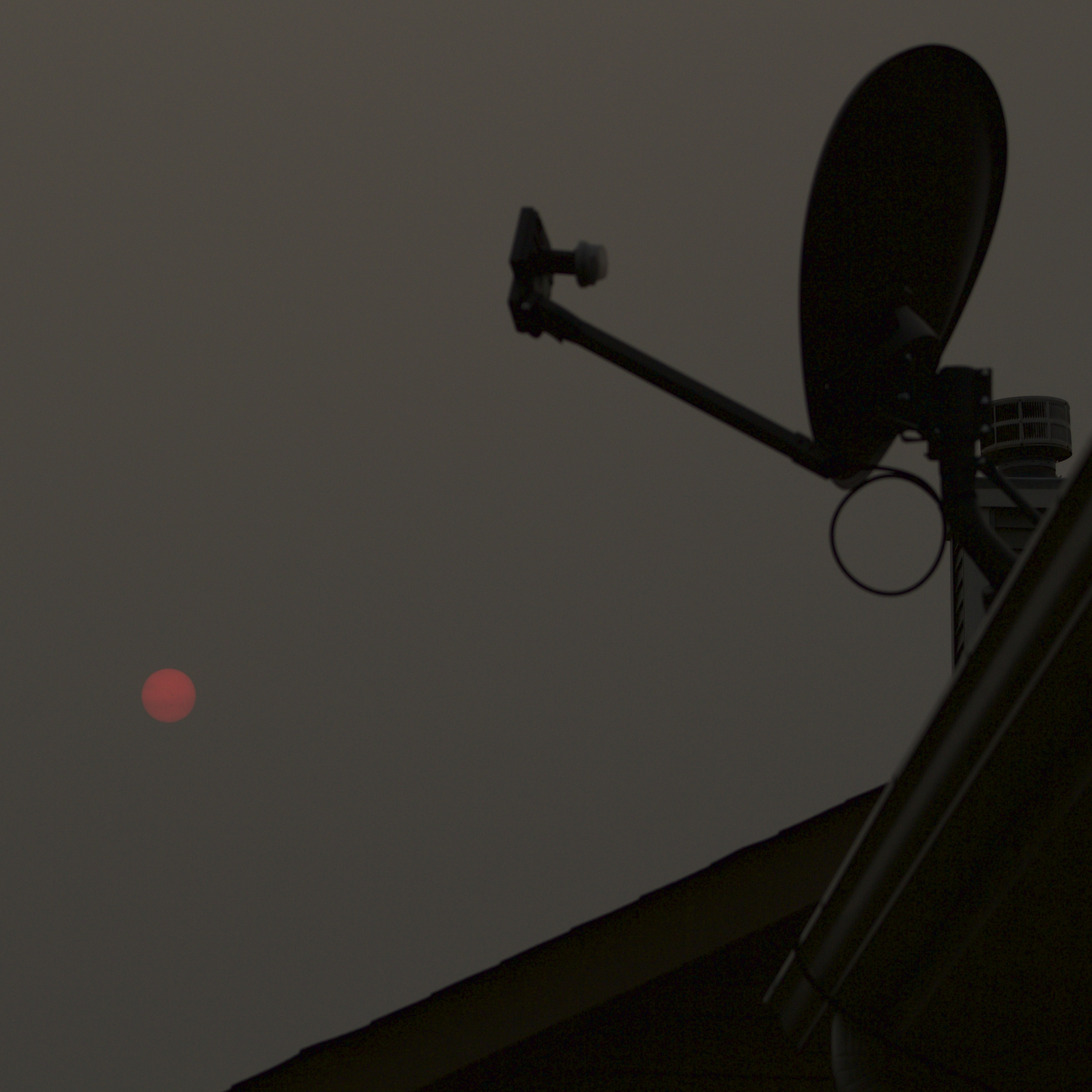 Eerie Red Sun Through Clouds with Visible Sunspots [Stellar Neophyte Astronomy Blog]