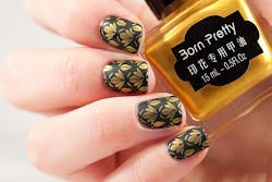 Black and gold nail art May contain traces of polish
