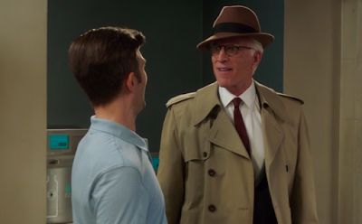 Michael in a Dick Tracy-style hat and trenchcoat