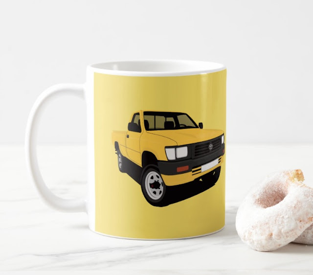 Toyota Hilux pickup truck yellow two image coffee mug