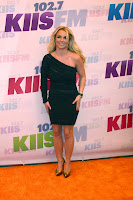 Britney Spears posing for cameras in a black dress
