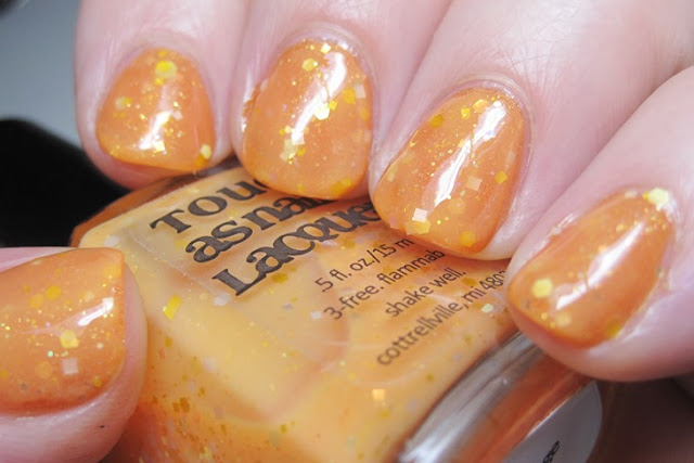 Literary Lacquers More Like Fire Than Light with Tough As Nails Lacquer Orange Whip over it