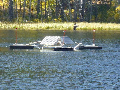 SolarBee with angler in the background Floating SolarBee machine
