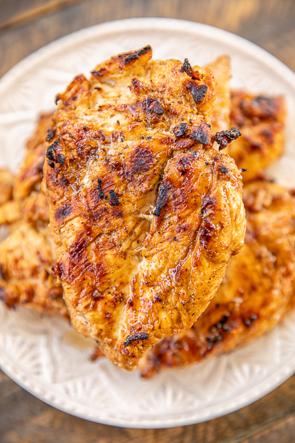 The BEST Grilled Chicken - SO good!!! We made this twice in one week! We just couldn't get enough of it!!! Chicken marinated in olive oil, onion powder, cider vinegar, sugar, chili powder, salt, Worcestershire, pepper, ground mustard, hot sauce and garlic. Leftovers are great on top of salads or in wraps. This is the most tender and juicy chicken we've ever made. SO much amazing flavor!! #chicken #marinade #grill #grilling #grilledchicken The BEST Grilled Chicken - SO good!!! We made this twice in one week! We just couldn't get enough of it!!! Chicken marinated in olive oil, onion powder, cider vinegar, sugar, chili powder, salt, Worcestershire, pepper, ground mustard, hot sauce and garlic. Leftovers are great on top of salads or in wraps. This is the most tender and juicy chicken we've ever made. SO much amazing flavor!! #chicken #marinade #grill #grilling #grilledchicken