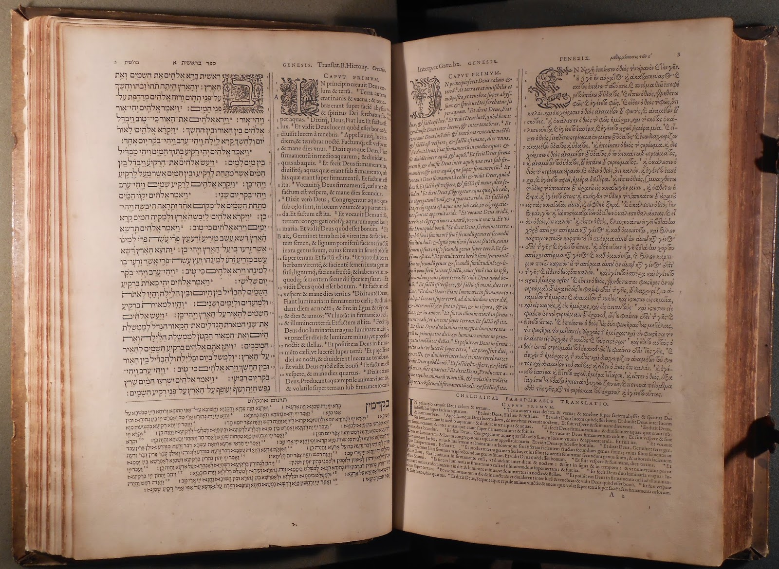 An open book showing several columns of text in Hebrew, Greek, Latin, Syriac, and Aramaic.
