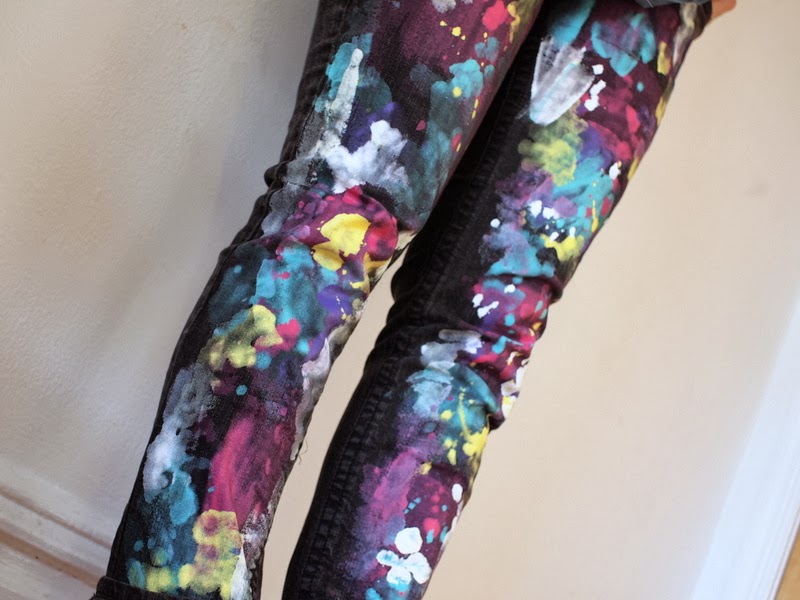 black jeans with pink paint splatter