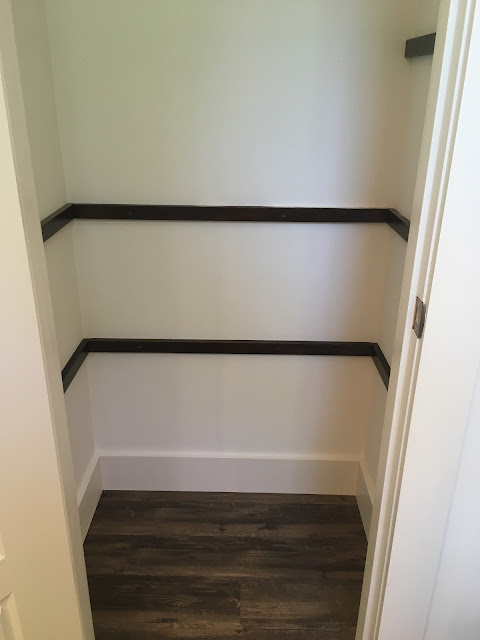 Dark Polyshades stained bathroom closet shelves in Espresso gloss | The Lowcountry Lady