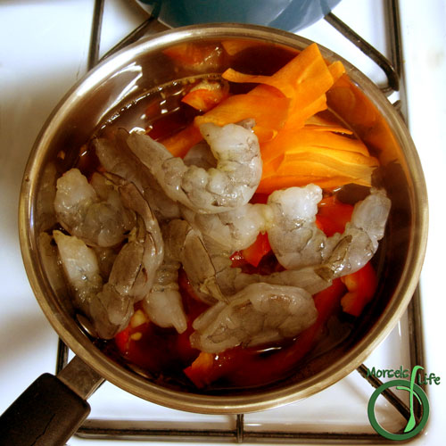 Morsels of Life - Tom Yum Step 5 - Stir in shrimp, bell peppers, tomatoes, and carrots.