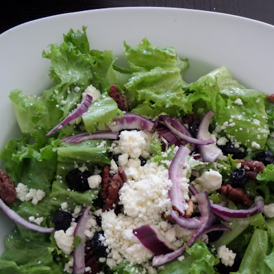Blueberry and Feta Salad:  A green salad with sweet dried blueberries and salty feta cheese tossed in lemon oregano dressing.
