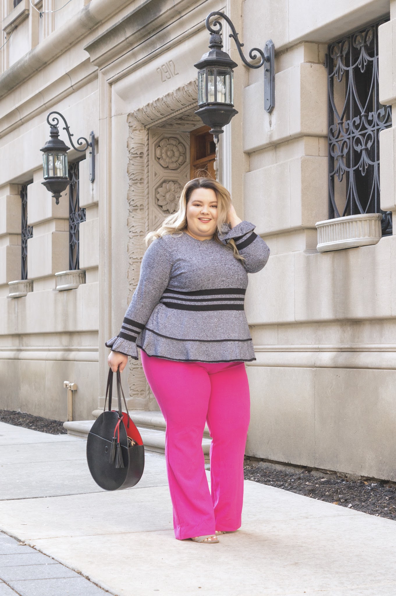 Chicago Plus Size Fashion Blogger Natalie in the City reviews Eloquii's sweaters and the Victoria Beckham for Target Fuscia Twill Flared Trousers.