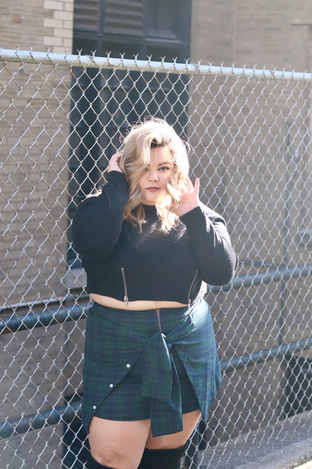 Chicago Plus Size Petite Fashion Blogger and model Natalie Craig reviews Soncy's Not Your Average Plaid Skirt and The Zip It Up Lightweight Sweater.