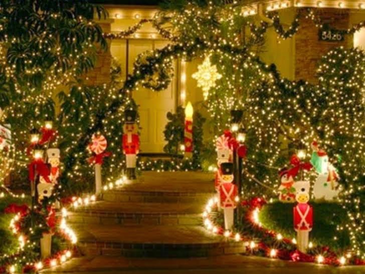 Keep pathways clear of snow and ice. Holiday decorations make for an inviting front door and walkway.