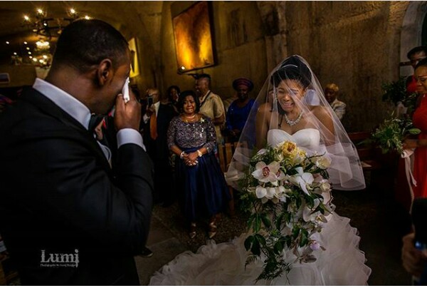 Photo of a Nigerian man and his wife crying during their wedding