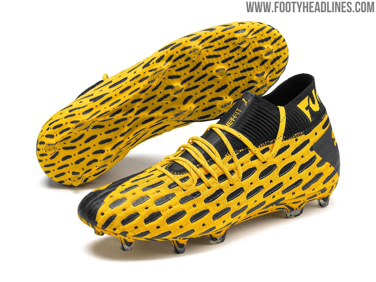 yellow and black puma shoes