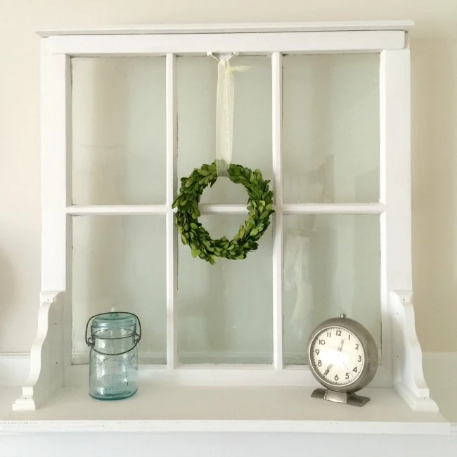 Window shelf with mason jar and clock