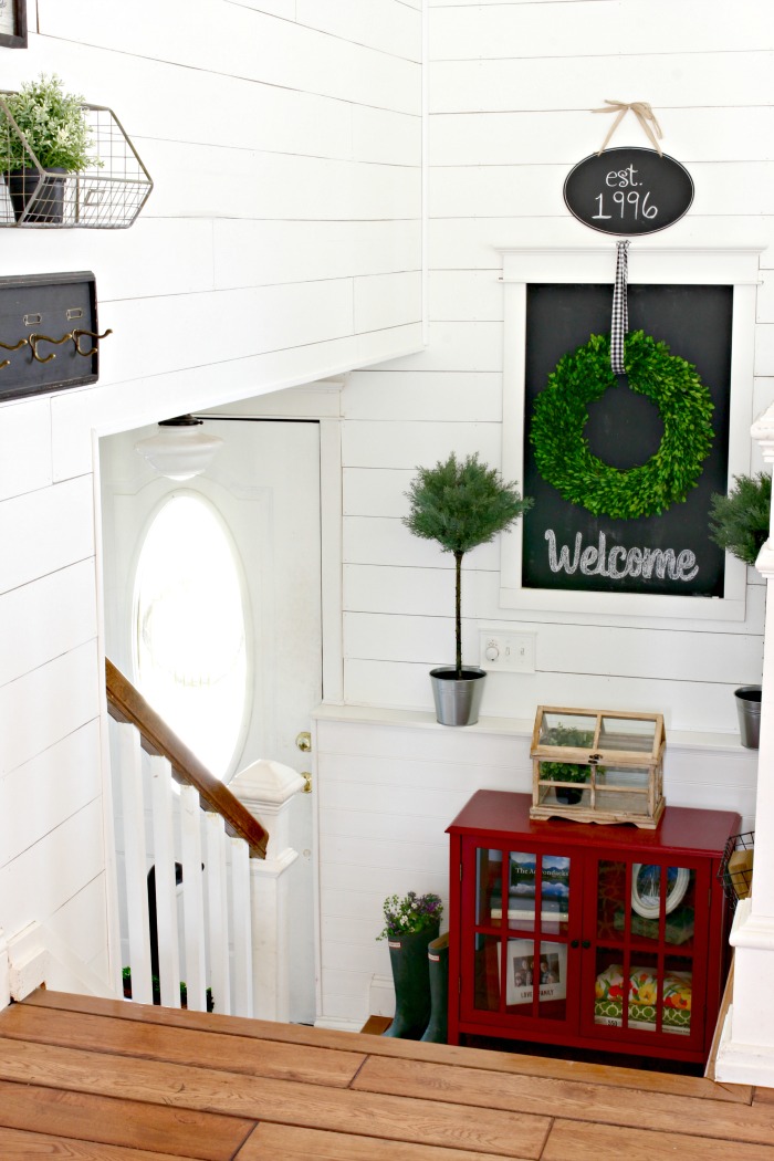 DIY entryway with wall planking and chalkboard, preserved boxwood wreath, and Ikea topiaries - www.goldenboysandme.com
