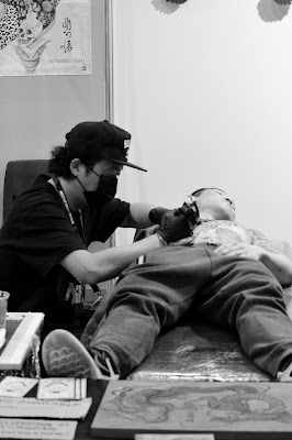 Attendees exploring tattoo booths