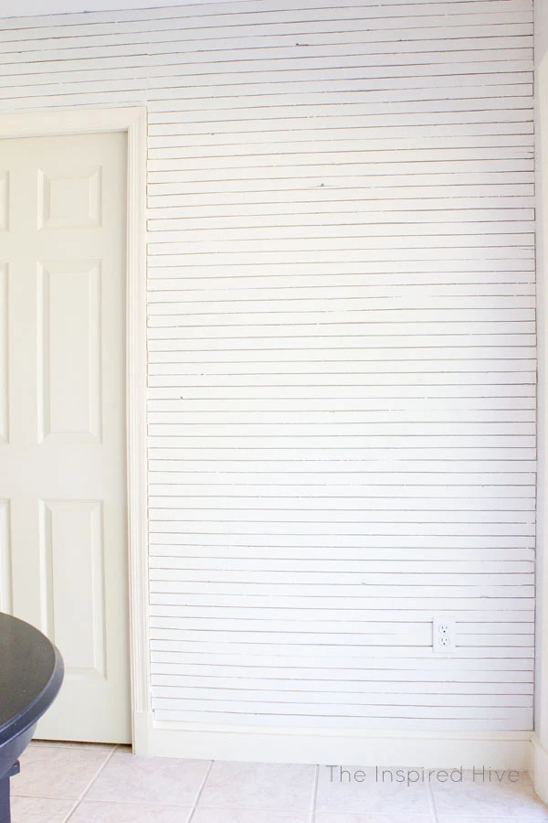 DIY Skinnylap- How to install thin faux shiplap. Get the Fixer Upper modern farmhouse look with a wood lath feature wall. 