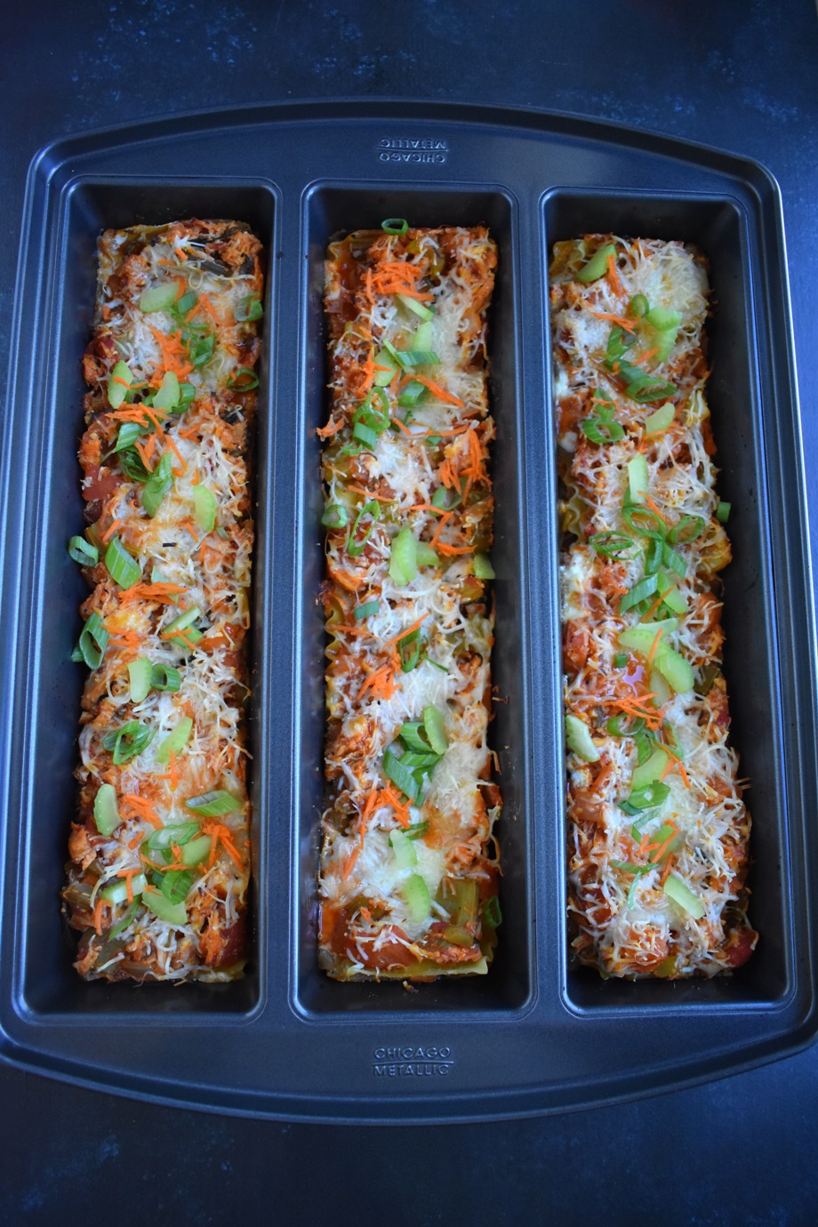 Buffalo Chicken Lasagna is loaded with spicy buffalo flavor, shredded chicken, celery, carrots, onions and is covered in melted cheese. It is rich and creamy making it the perfect filling dinner! www.nutritionistreviews.com