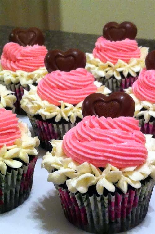 Chocolate Cupcakes Topped w/ Vanilla & Strawberry Frosting and a Heart-Shaped Chocolate Bonbon