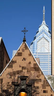 Old church and modern skyscraper in Center City Philadelphia in winter