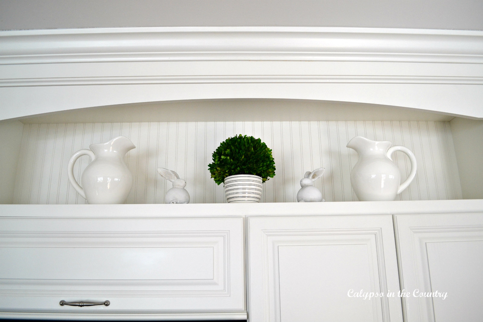 White pitchers, bunnies and beadboard