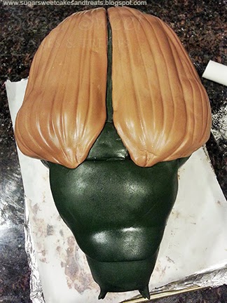 Adding fondant wings to the beetle cake
