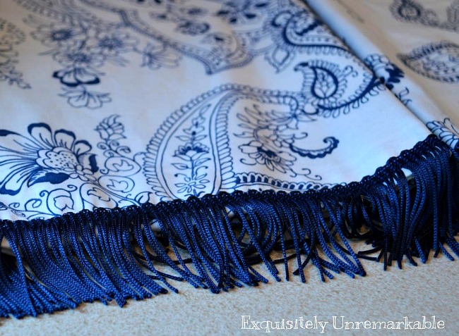 How To Add Trim To A Curtain or Valance Blue fringe trim on blue and white paisley fabric