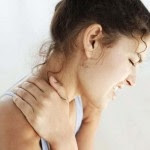 blog picture of lady grabbing her neck experiencing neck pain