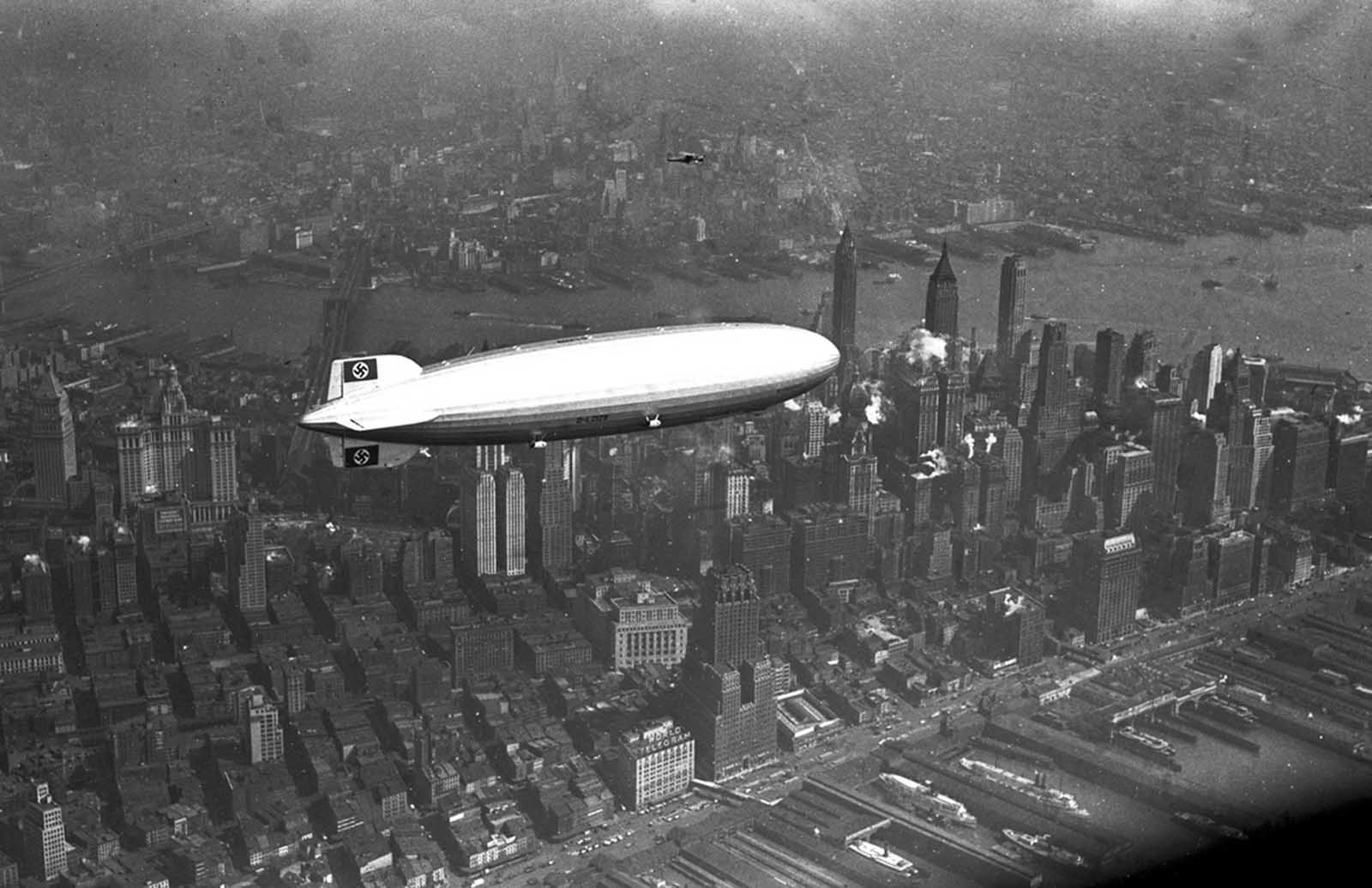 The German zeppelin Hindenburg flies over Manhattan on May 6, 1937. A few hours later, the ship burst into flames in an attempt to land at Lakehurst, New Jersey.