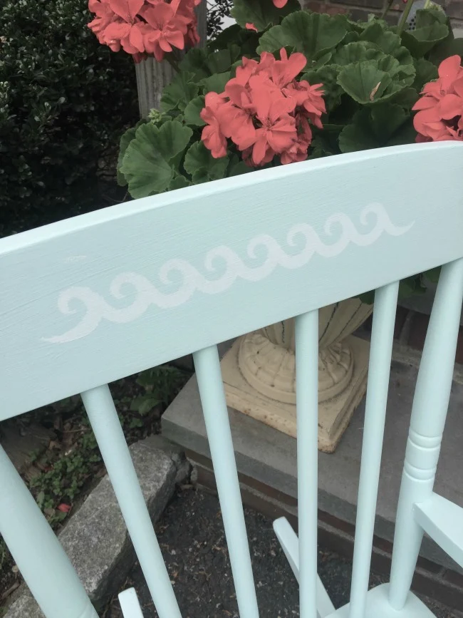 stenciled top of rocking chair with waves