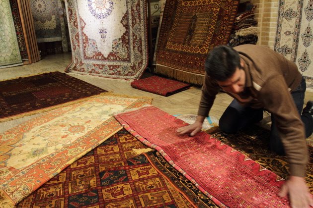 Exquisite silk Persian carpets at the grand bazaar of Isfahan, Iran