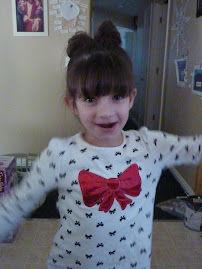 Meg did Katie's hair - see it looks like a bow just like on her shirt. lol