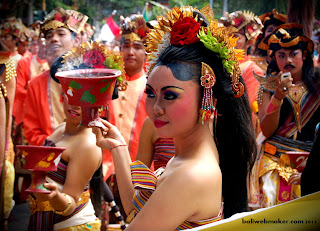 girl with offering scent burnt at Bali Art Festival 2011