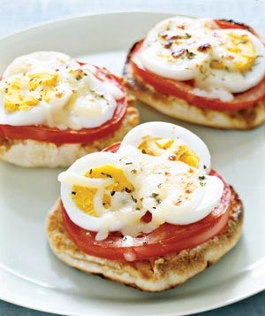 These mini English muffin pizzas topped with hard boiled eggs and tomatoes are delicious.