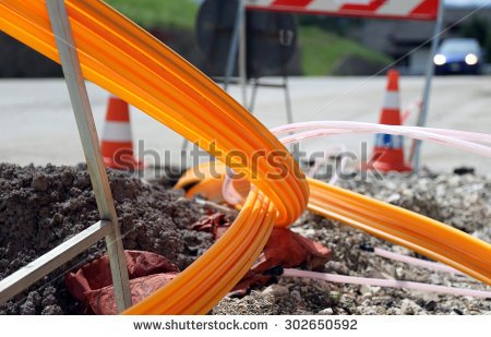 stock-photo-road-excavation-for-the-laying-of-optical-fiber-for-very-high-speed-internet-302650592.jpg